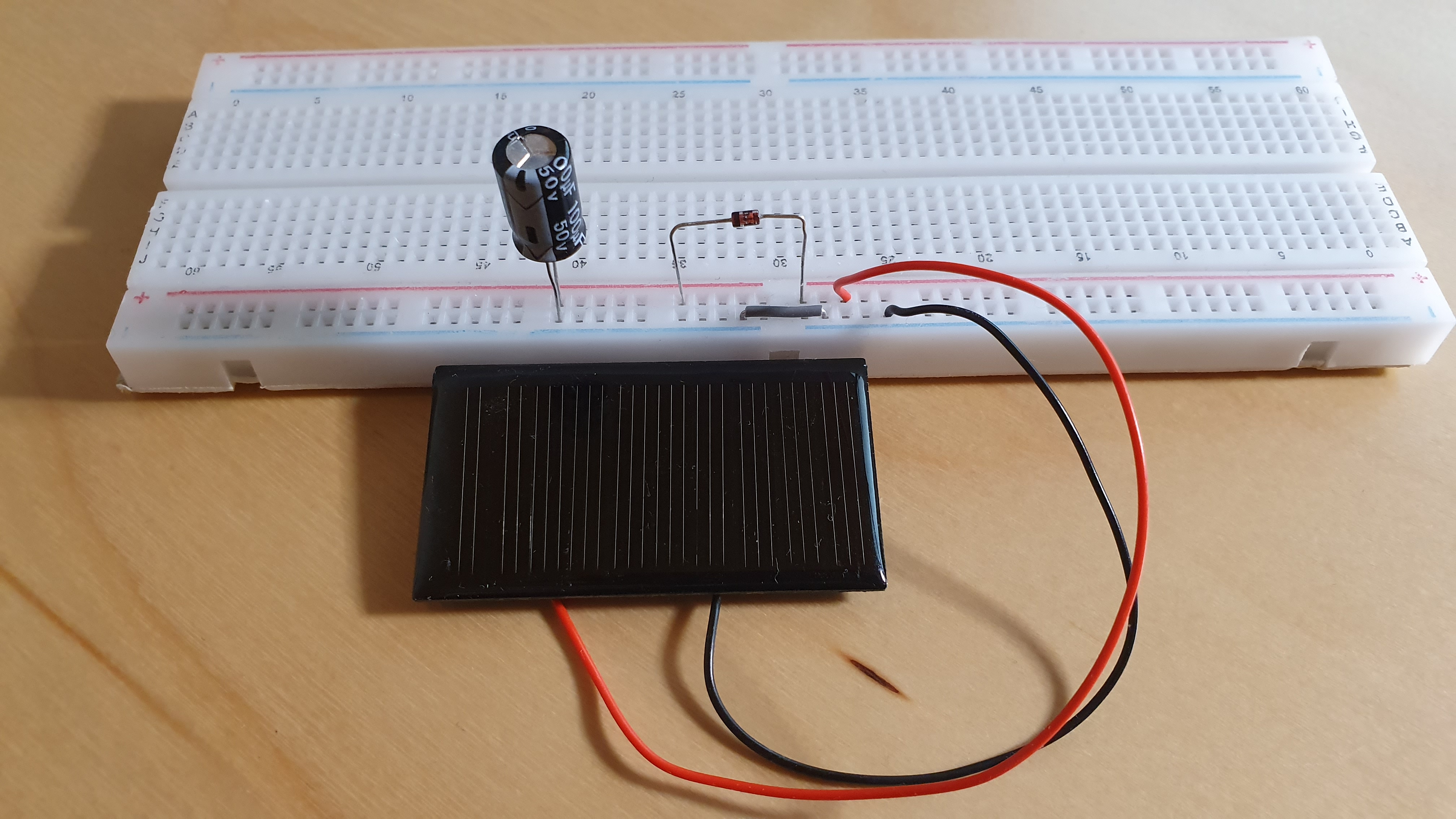 Solar panel connected to a capacitor through a diode